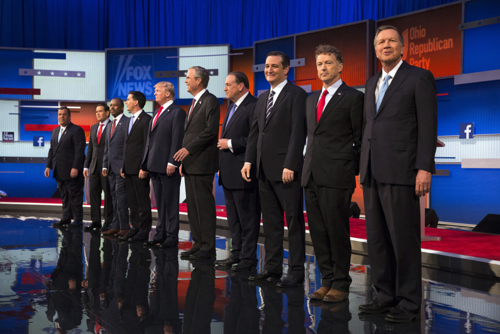 Republican presidential candidates from left, Chris Christie, Marco Rubio, Ben Carson, Scott Walker, Donald Trump, Jeb Bush, Mike Huckabee, Ted Cruz, Rand Paul, and John Kasich take the stage for the first Republican presidential debate at the Quicken Loans Arena Thursday, Aug. 6, 2015, in Cleveland. (AP Photo/John Minchillo) ORG XMIT: OHJM122